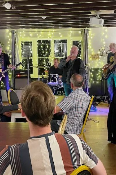 A live band playing in the bar at The Broad Oak
